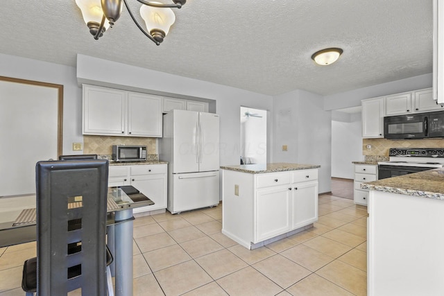 kitchen with white cabinetry, white appliances, light tile patterned floors, and tasteful backsplash