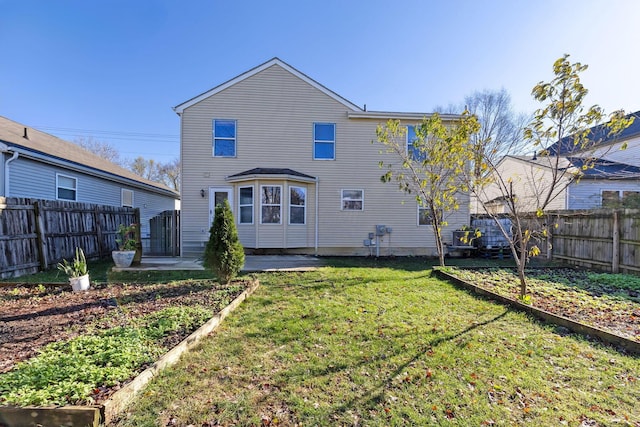 back of property with a patio and a lawn