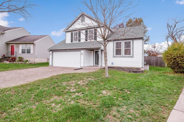 view of front property featuring a front yard and a garage