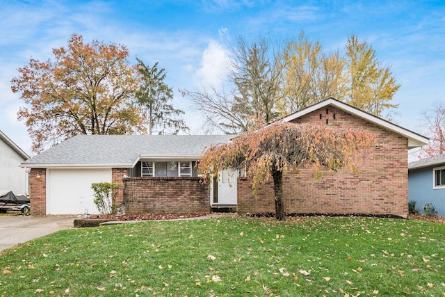 view of front of home featuring a garage and a front lawn