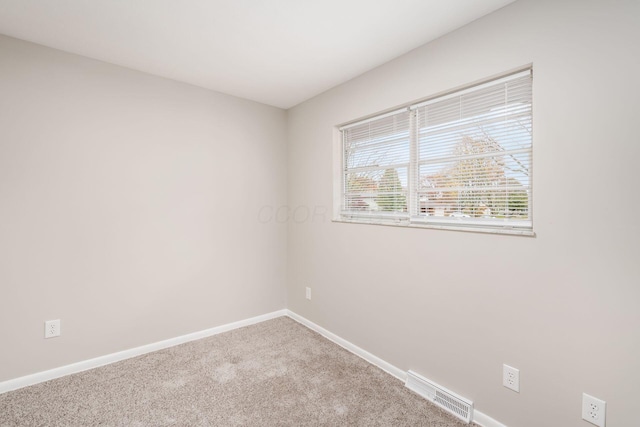 spare room with carpet floors