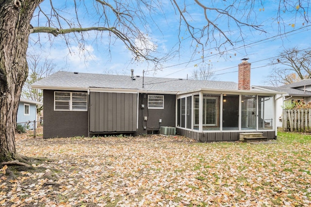 back of house with a sunroom and cooling unit