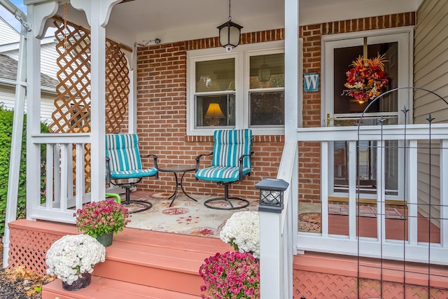 wooden terrace featuring covered porch