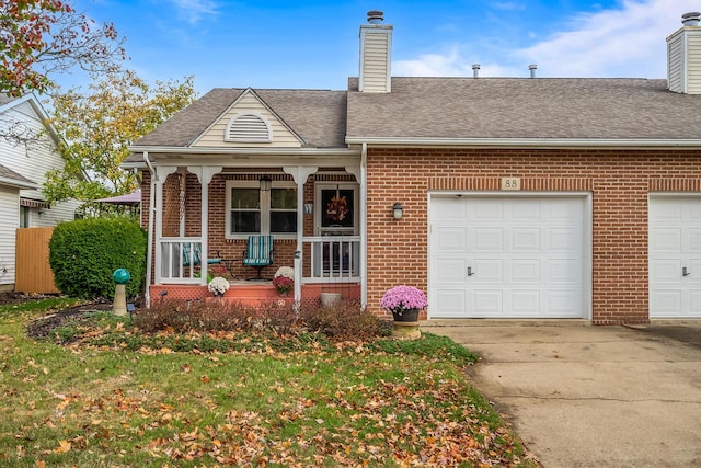 view of front of house with a porch and a garage