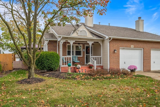 view of front of house with a front lawn, a porch, and a garage