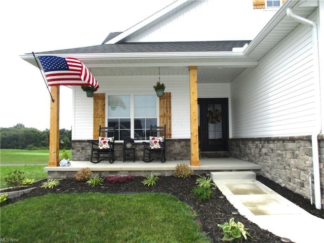 doorway to property featuring covered porch