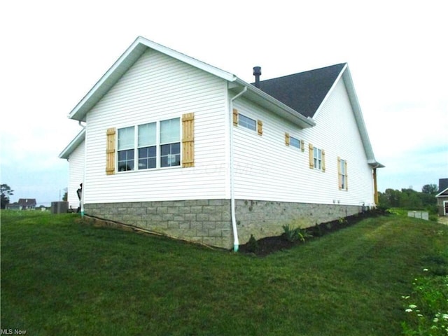 view of home's exterior featuring a lawn