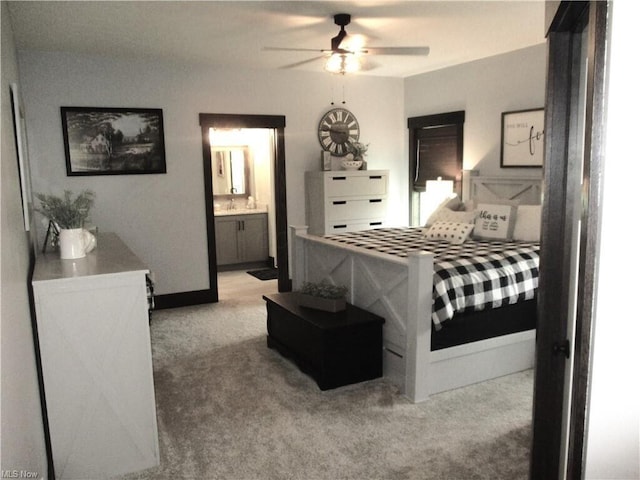 carpeted bedroom featuring ceiling fan and connected bathroom