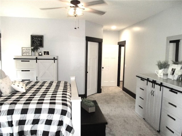 bedroom featuring light carpet and ceiling fan