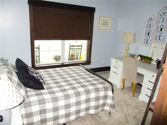 bedroom featuring light colored carpet