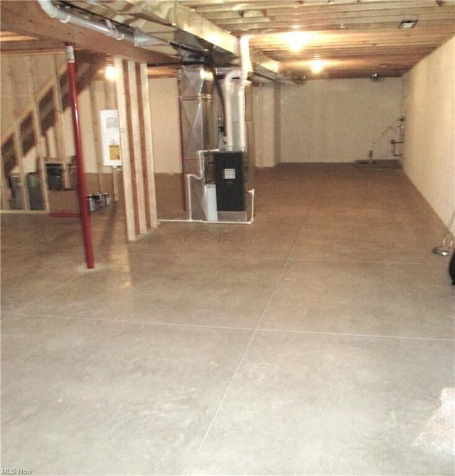 basement with heating unit and water heater