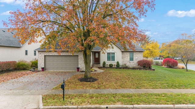 obstructed view of property featuring a front yard and a garage