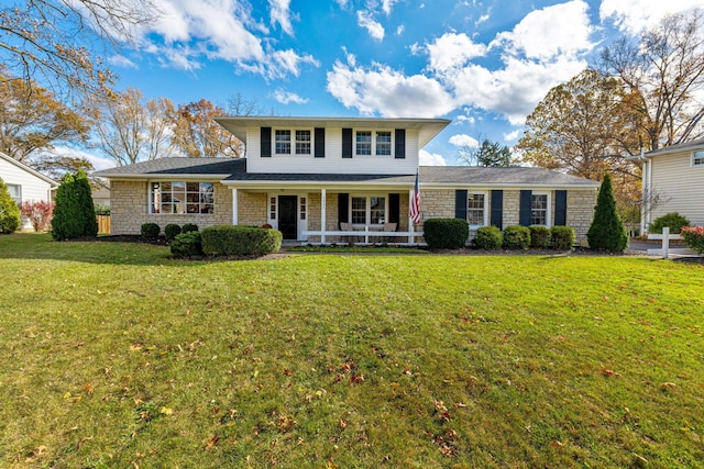 view of front facade featuring a porch and a front lawn