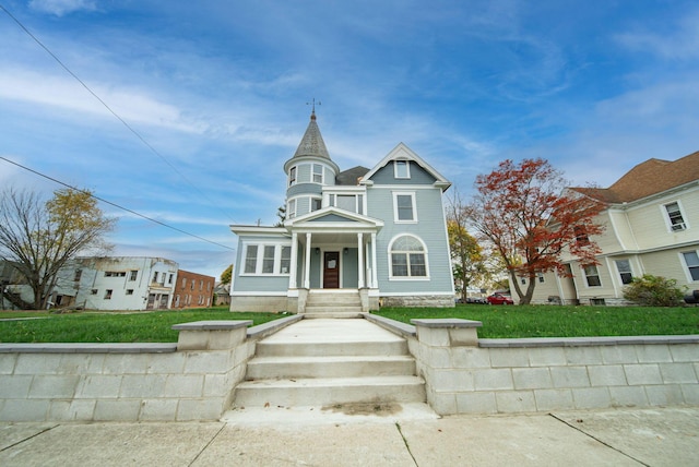 victorian home with a front yard