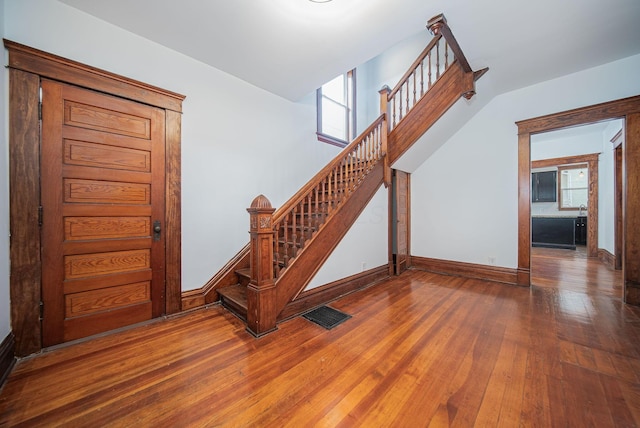 stairway with wood-type flooring