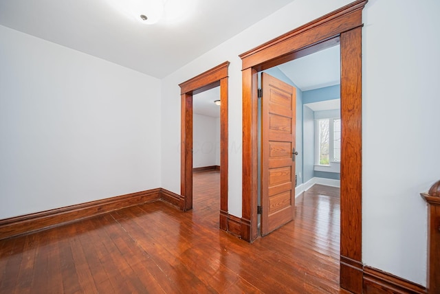 hall with dark hardwood / wood-style floors