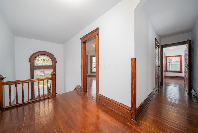 hall featuring dark wood-type flooring