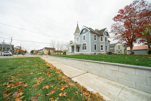 view of home's exterior with a lawn