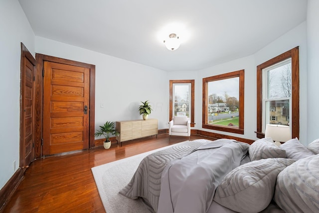 bedroom featuring dark wood-type flooring