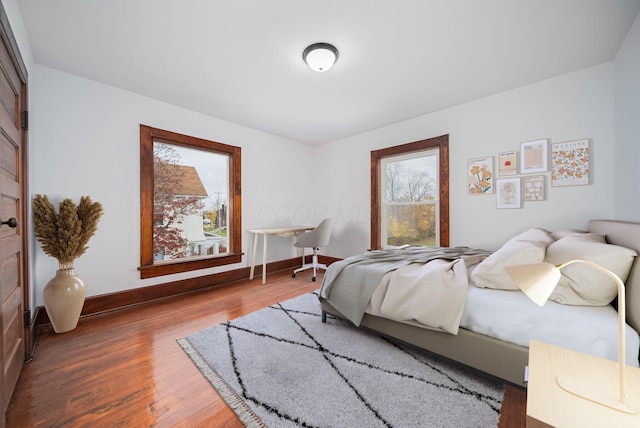 bedroom with wood-type flooring