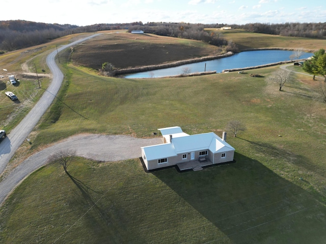 birds eye view of property featuring a rural view and a water view