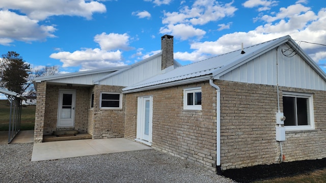 back of house with a patio