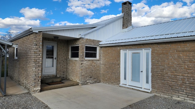 back of property featuring a patio