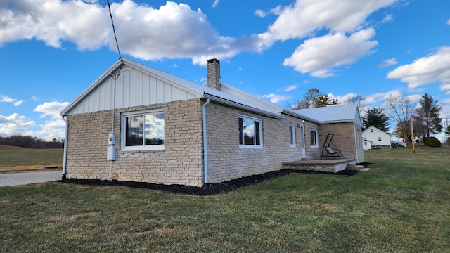 view of property exterior featuring a lawn