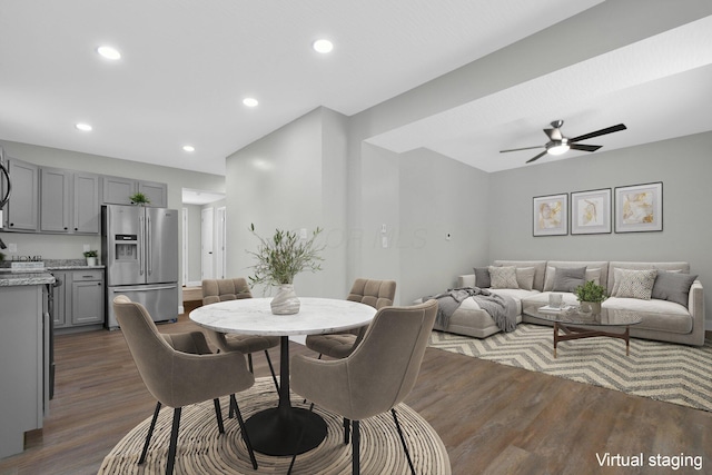 dining room with ceiling fan and dark hardwood / wood-style flooring