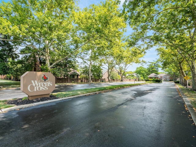 view of street featuring curbs, traffic signs, and sidewalks