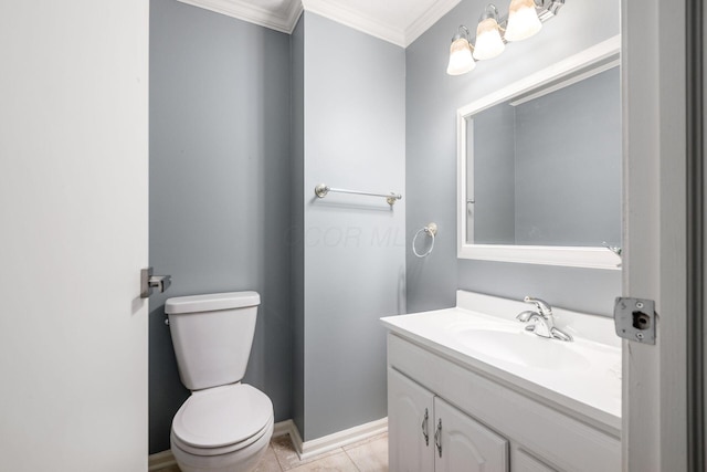 bathroom featuring toilet, vanity, baseboards, ornamental molding, and tile patterned floors