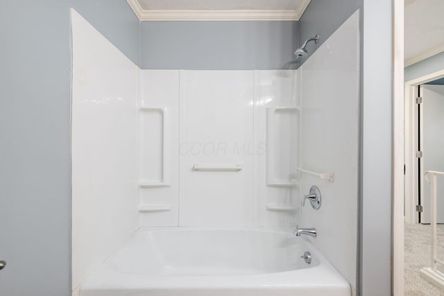 bathroom with  shower combination and crown molding