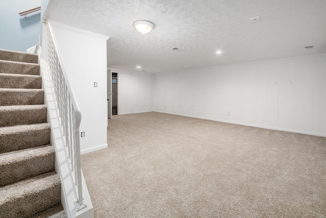 finished basement featuring light carpet, baseboards, stairway, a textured ceiling, and recessed lighting