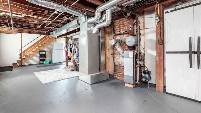 basement featuring white refrigerator