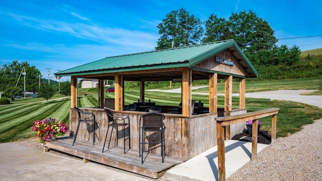 view of patio with exterior bar