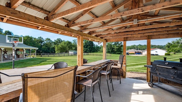 view of patio / terrace with grilling area and an outdoor bar