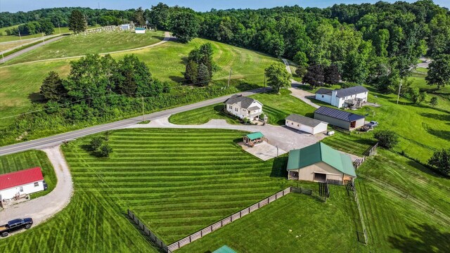 birds eye view of property with a rural view