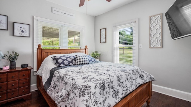 bedroom with ceiling fan and dark wood-type flooring