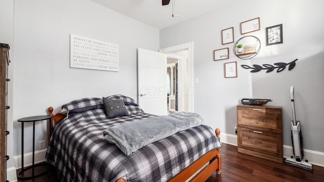 bedroom with ceiling fan and dark hardwood / wood-style flooring