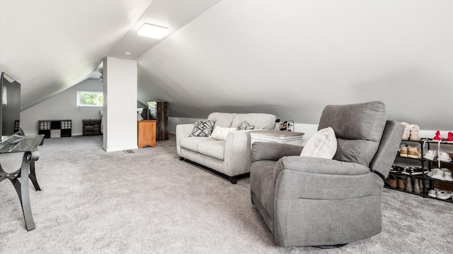 living room featuring light carpet and vaulted ceiling