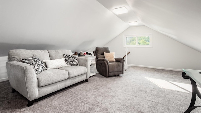 living room featuring carpet floors and vaulted ceiling