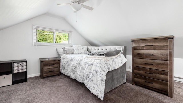 bedroom featuring ceiling fan, dark carpet, and vaulted ceiling