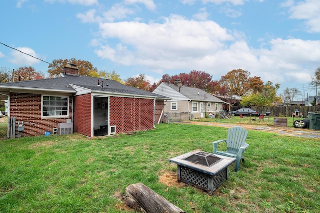 view of yard with an outdoor fire pit