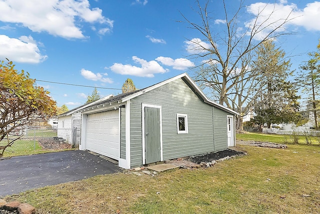 garage featuring a yard