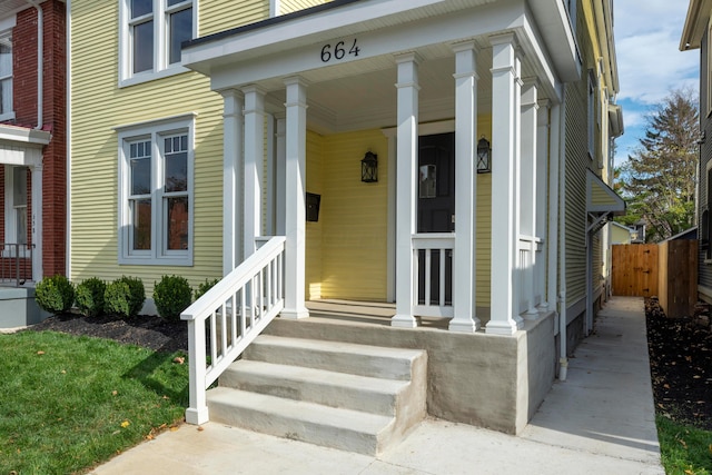 property entrance featuring a porch