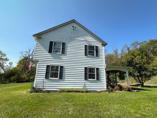 view of home's exterior featuring a lawn