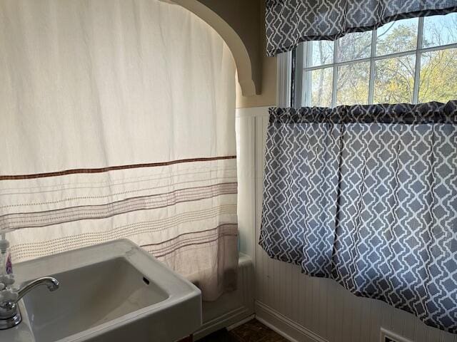 bathroom featuring shower / tub combination and sink