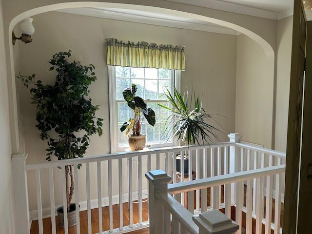 hall with hardwood / wood-style floors