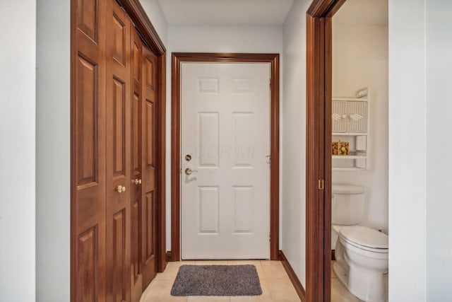 entryway with light tile patterned floors