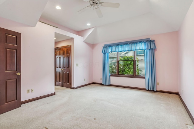 unfurnished room with light carpet and ceiling fan